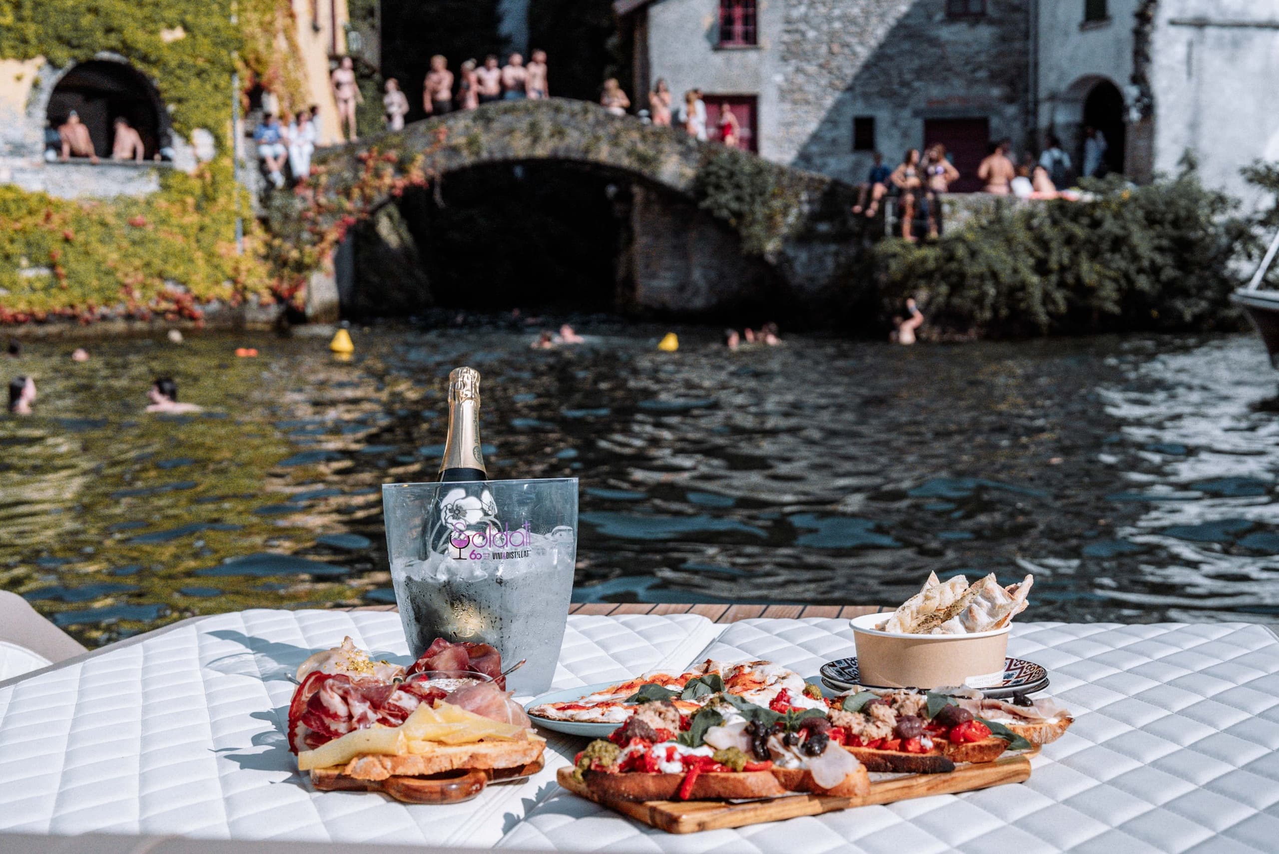 Lakeside picnic with antipasti and champagne on Lake Como