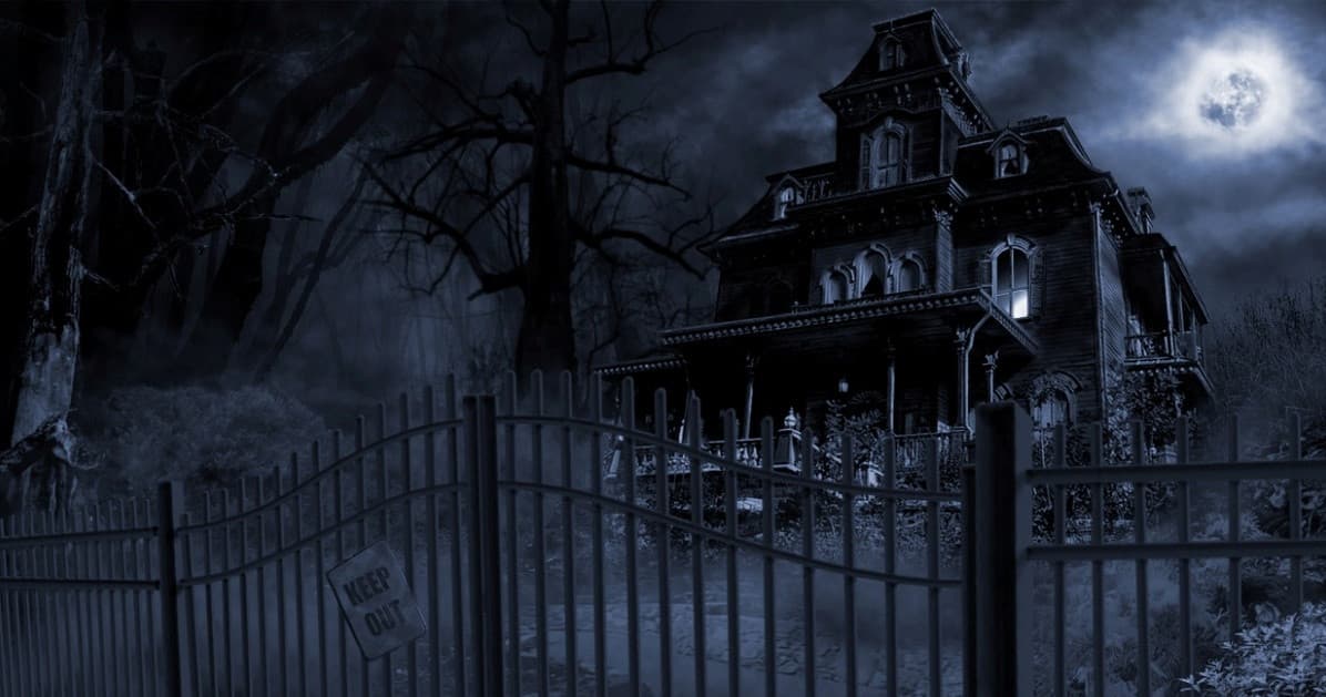 Eerie Victorian mansion at night for Newport ghost tour