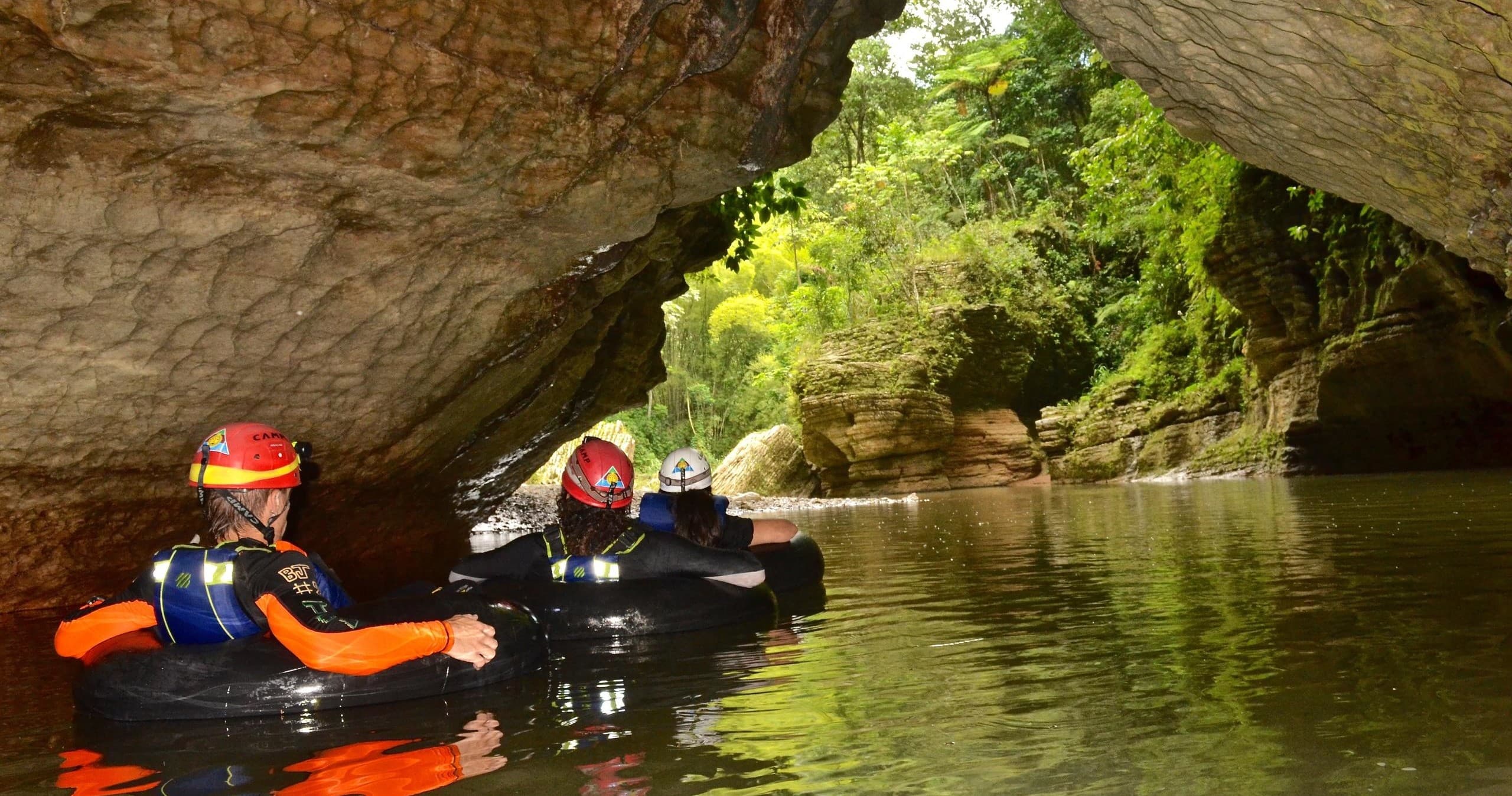 Guided river canyon tubing with helmets and life vests