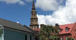 Historic church steeple and colorful rooftops in Charleston