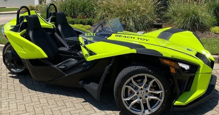 Coastal Polaris Slingshot Cruises with Orange Beach Toys