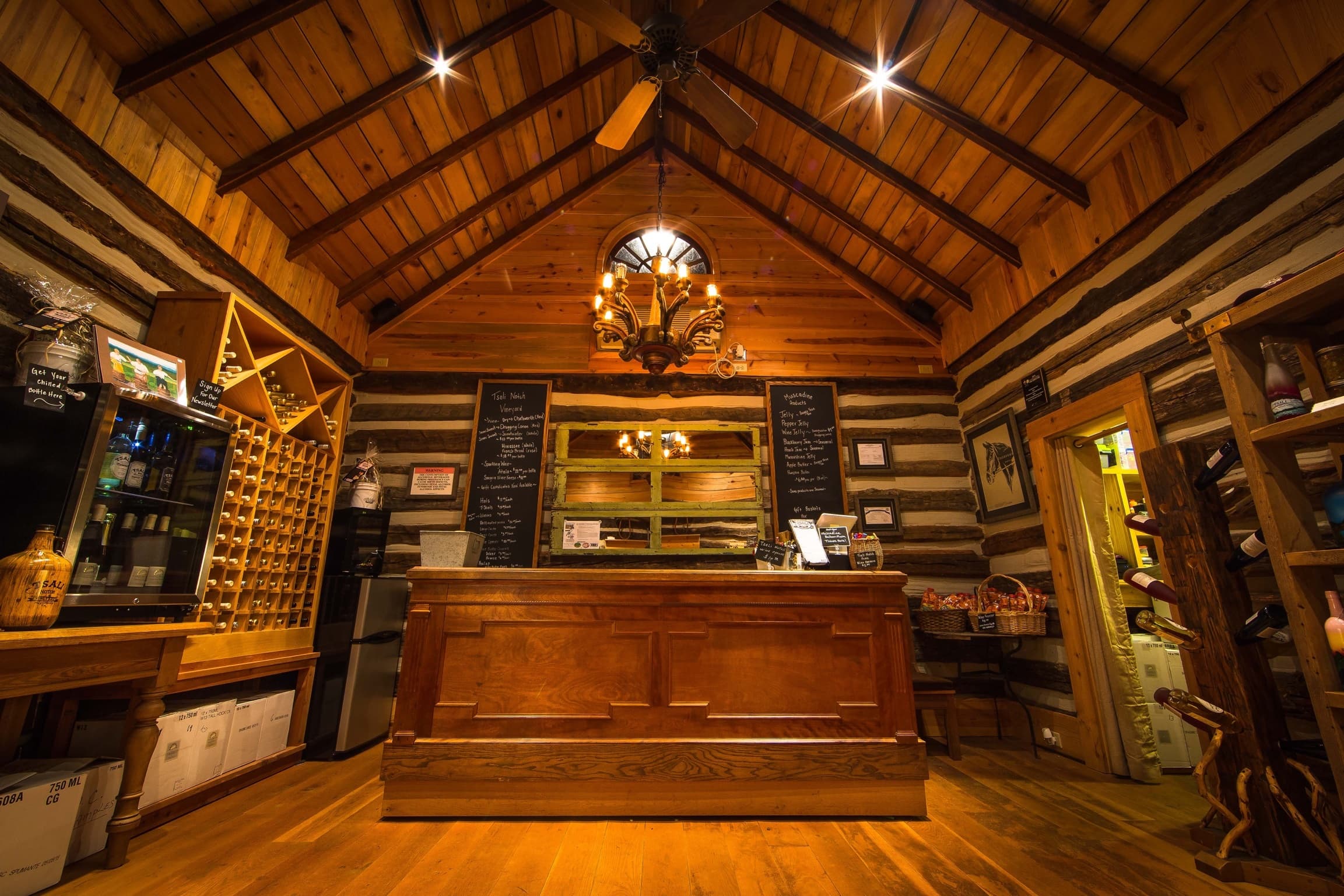 Cozy rustic tasting room interior with wooden bar and shelves