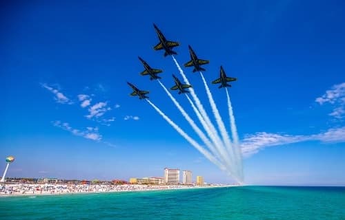 Navy jets flying formation over Pensacola Beach during airshow