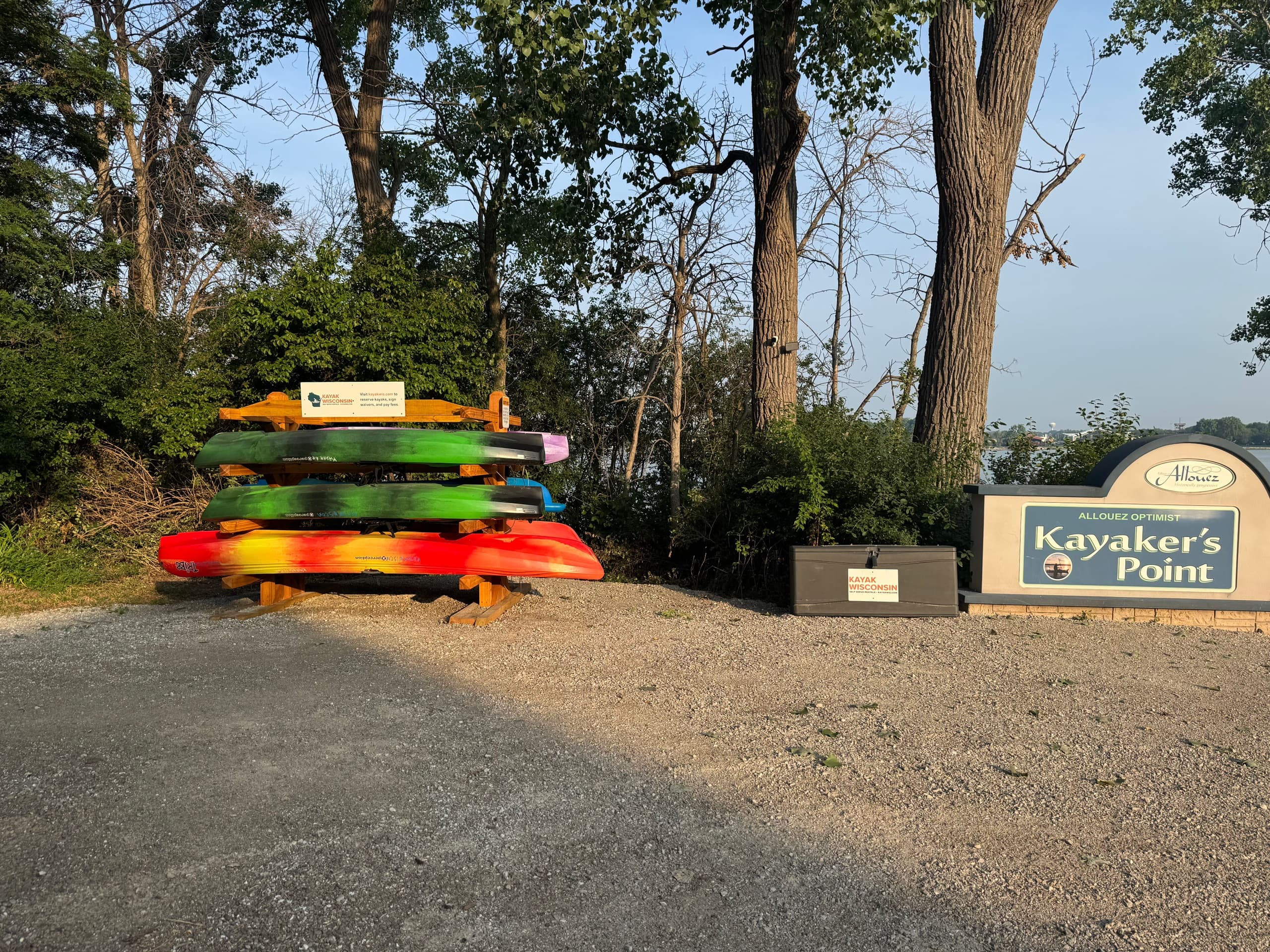 Stacked rental kayaks at Kayaker's Point launch, lakeside