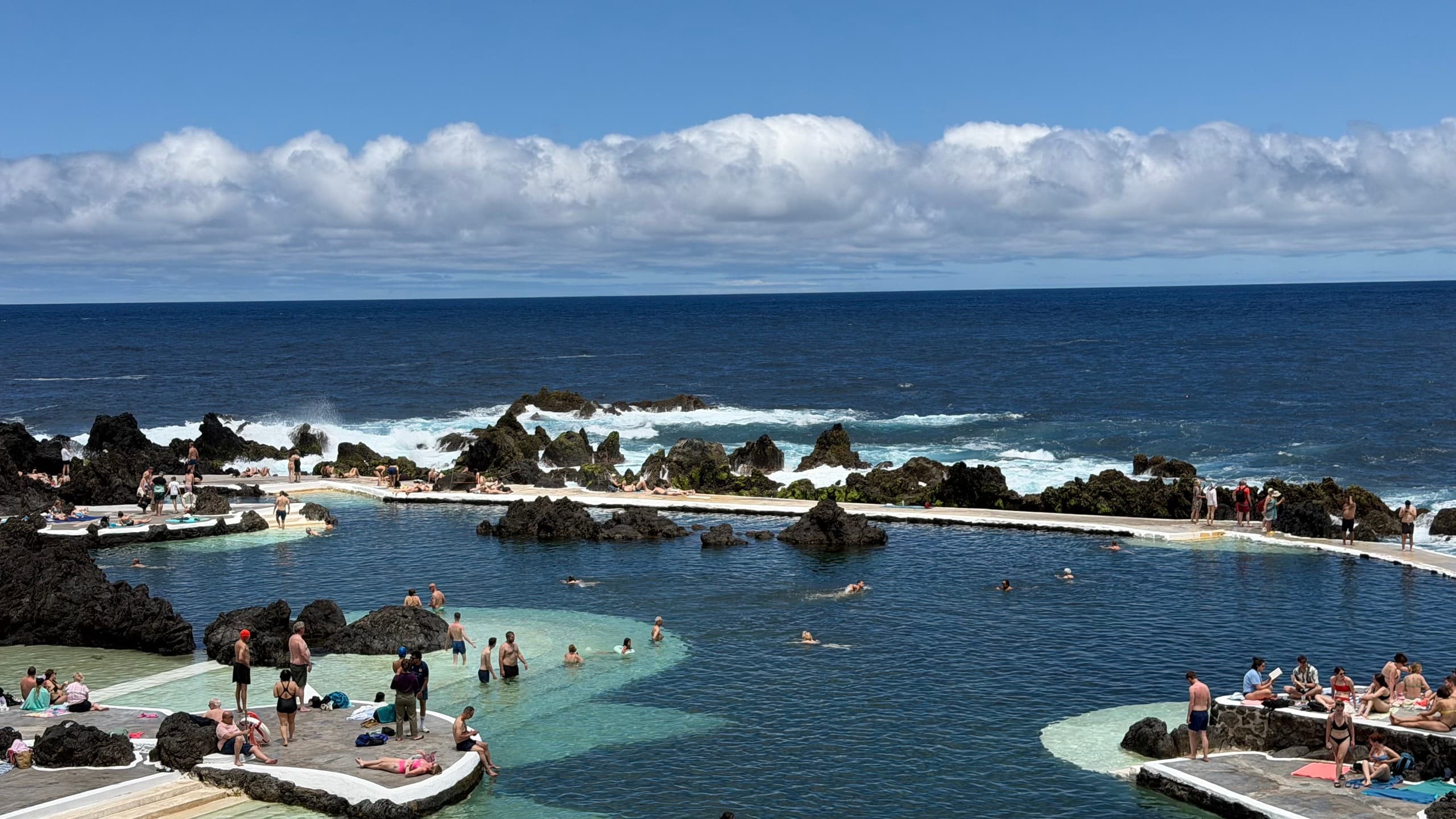 Secluded sea arch and bay with cliffside path in Madeira