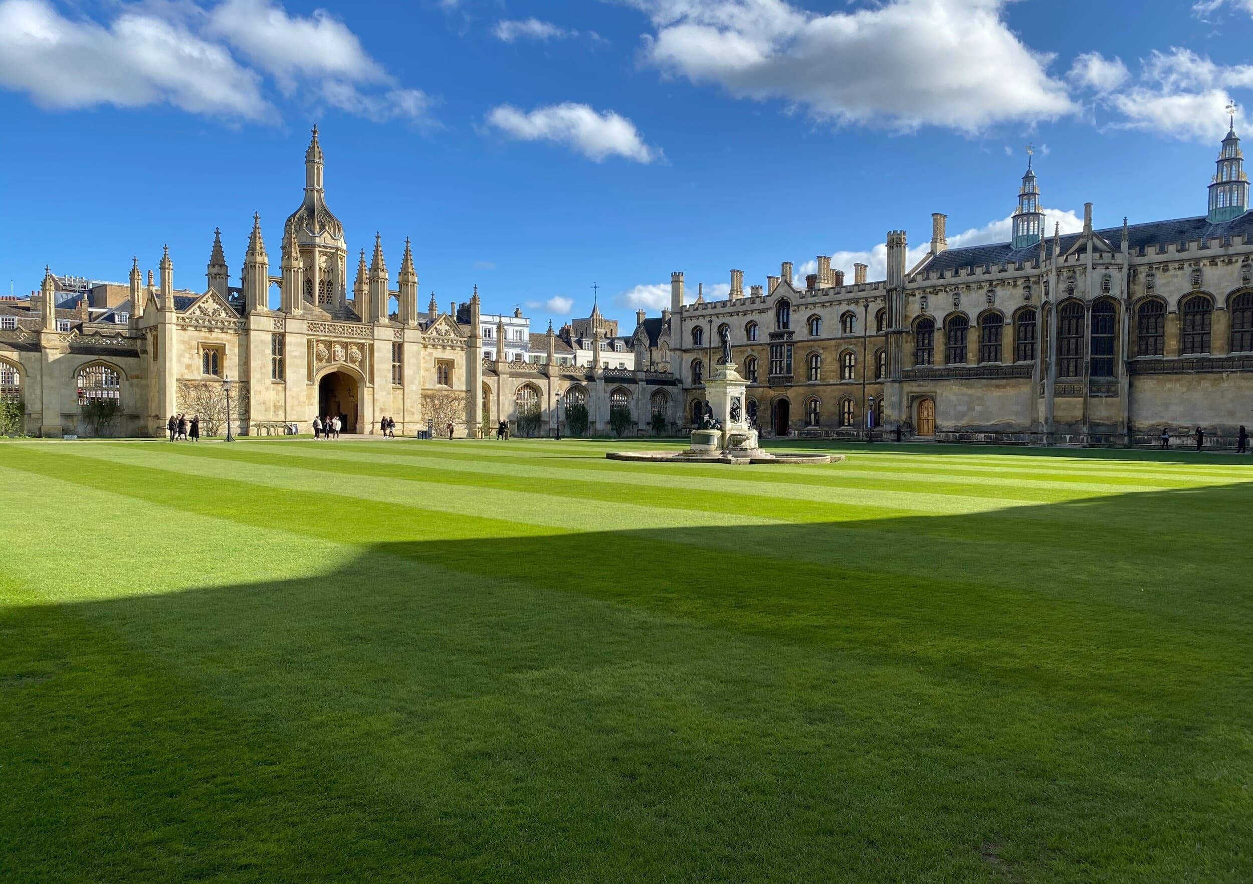 University cathedral and wide green lawn under blue sky