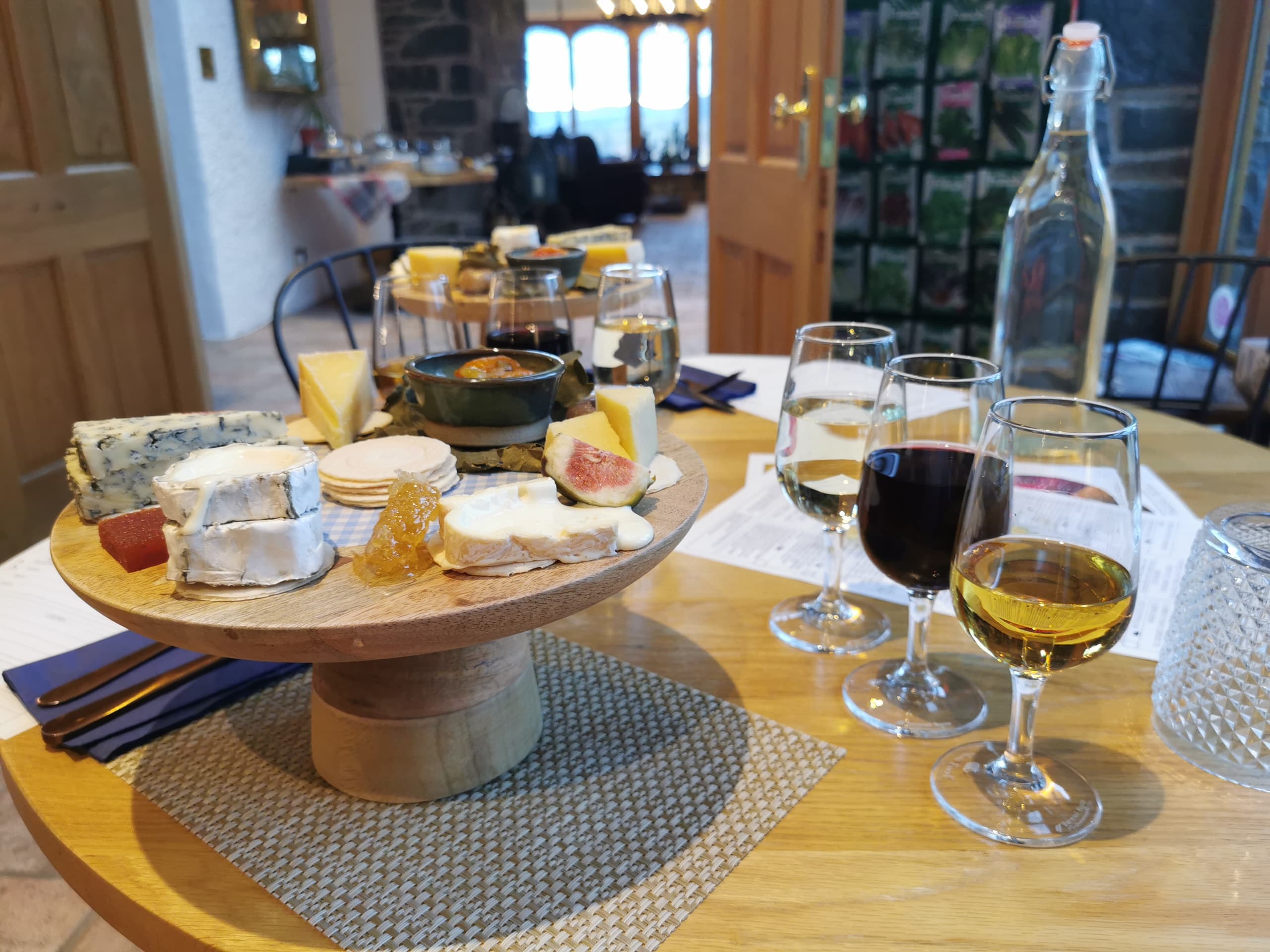 Artisan cheese and wine tasting in rustic dining room