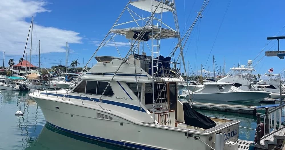Charter sportfishing boat docked in Hawaiian marina, ready for trip