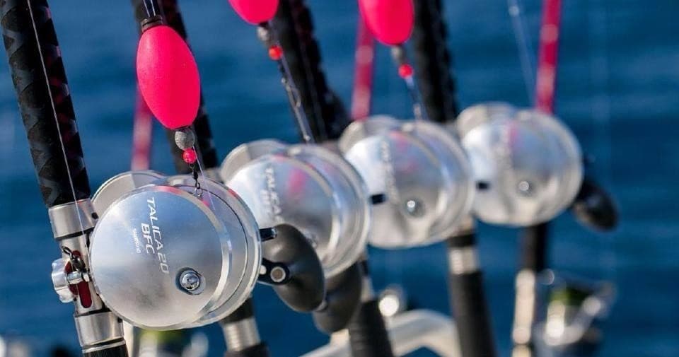 Close-up of fishing reels and rods on Galveston charter boat deck
