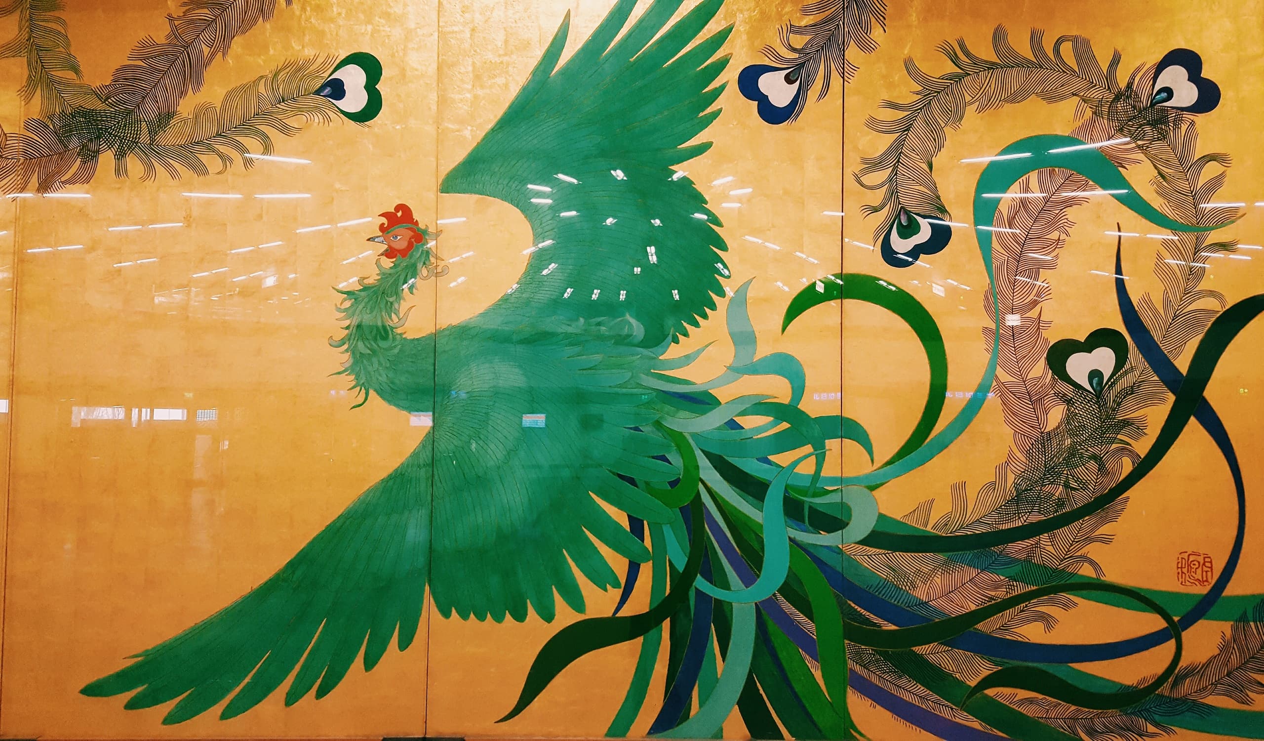 Indoor mural of green phoenix style bird at Vienna cultural site
