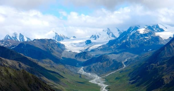 Panoramic Alaska mountain valley with glaciers and river views