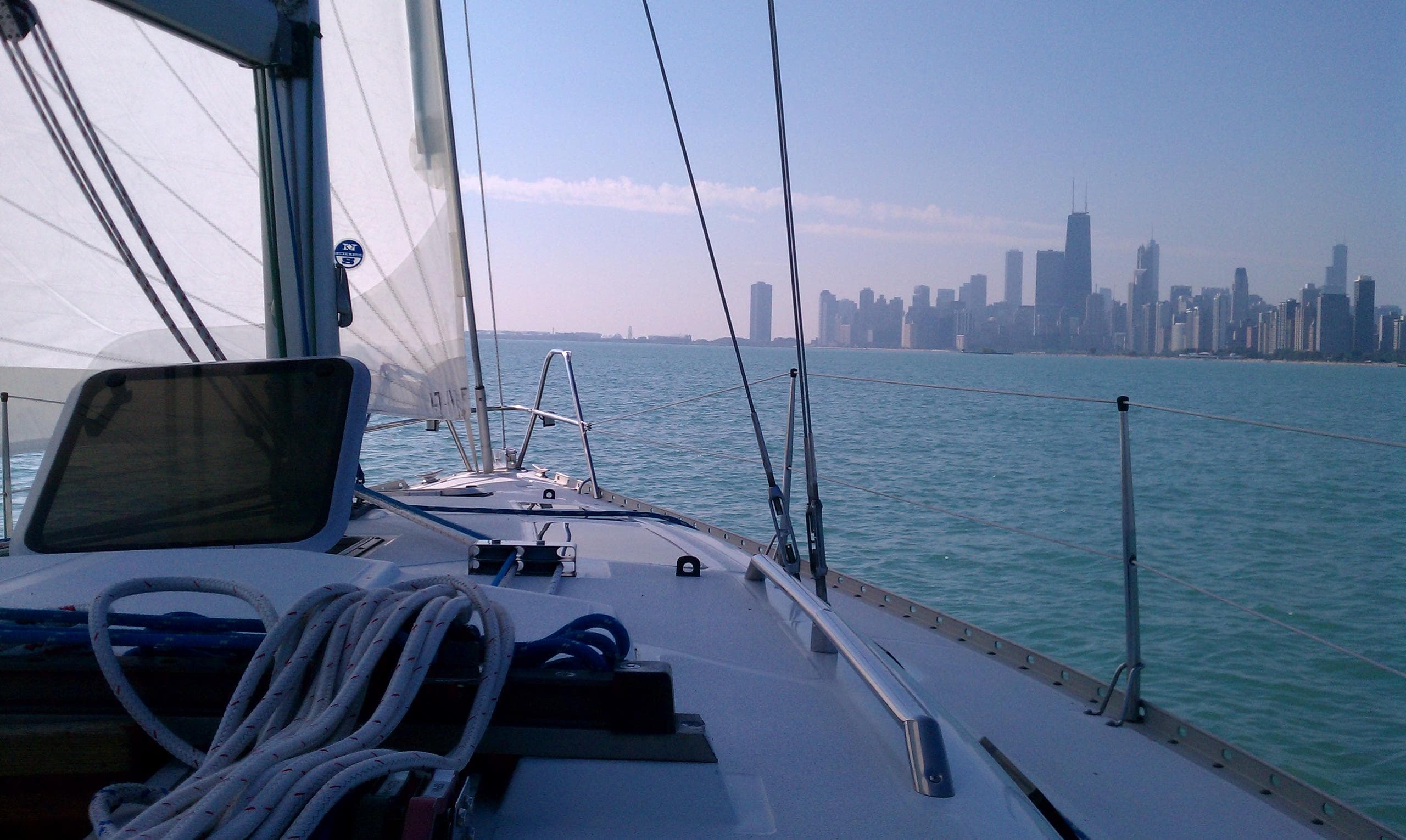 Bow deck view toward Chicago skyline during sail