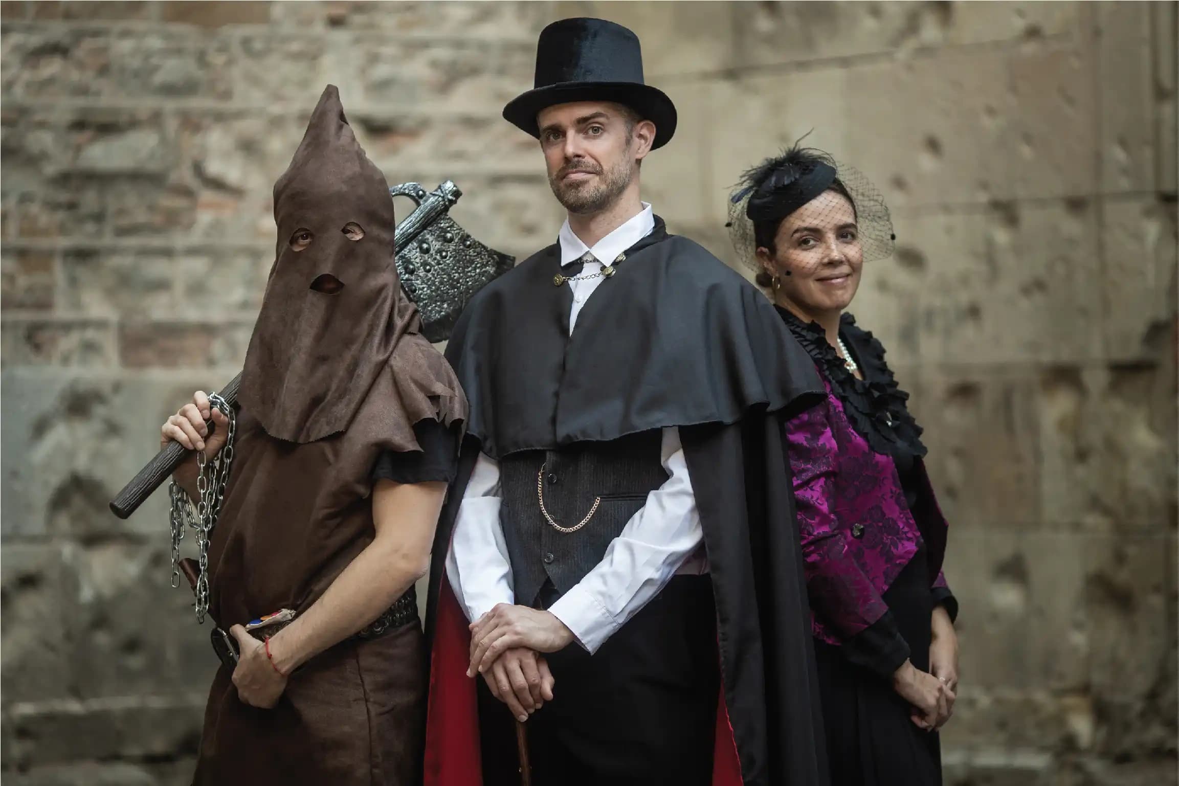 Costumed historical guides posing in medieval stone square