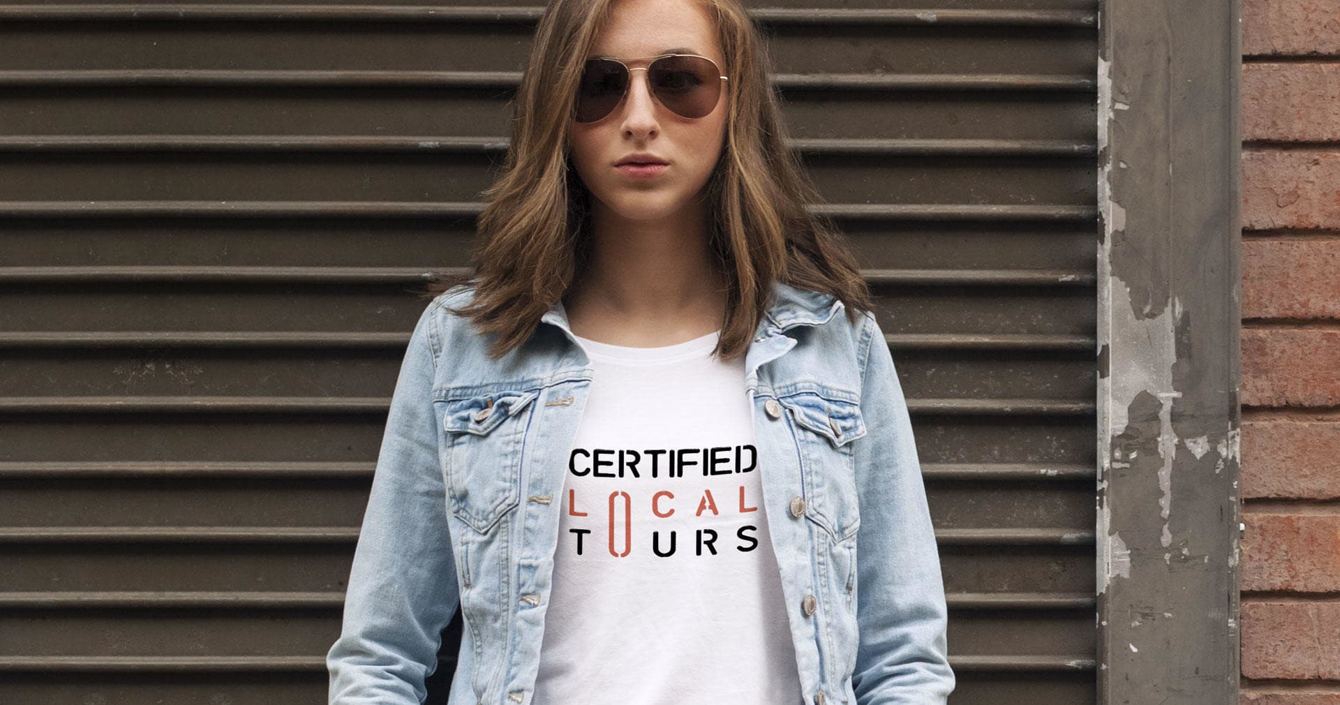 Guide wearing Certified Local Tours tee in urban street setting