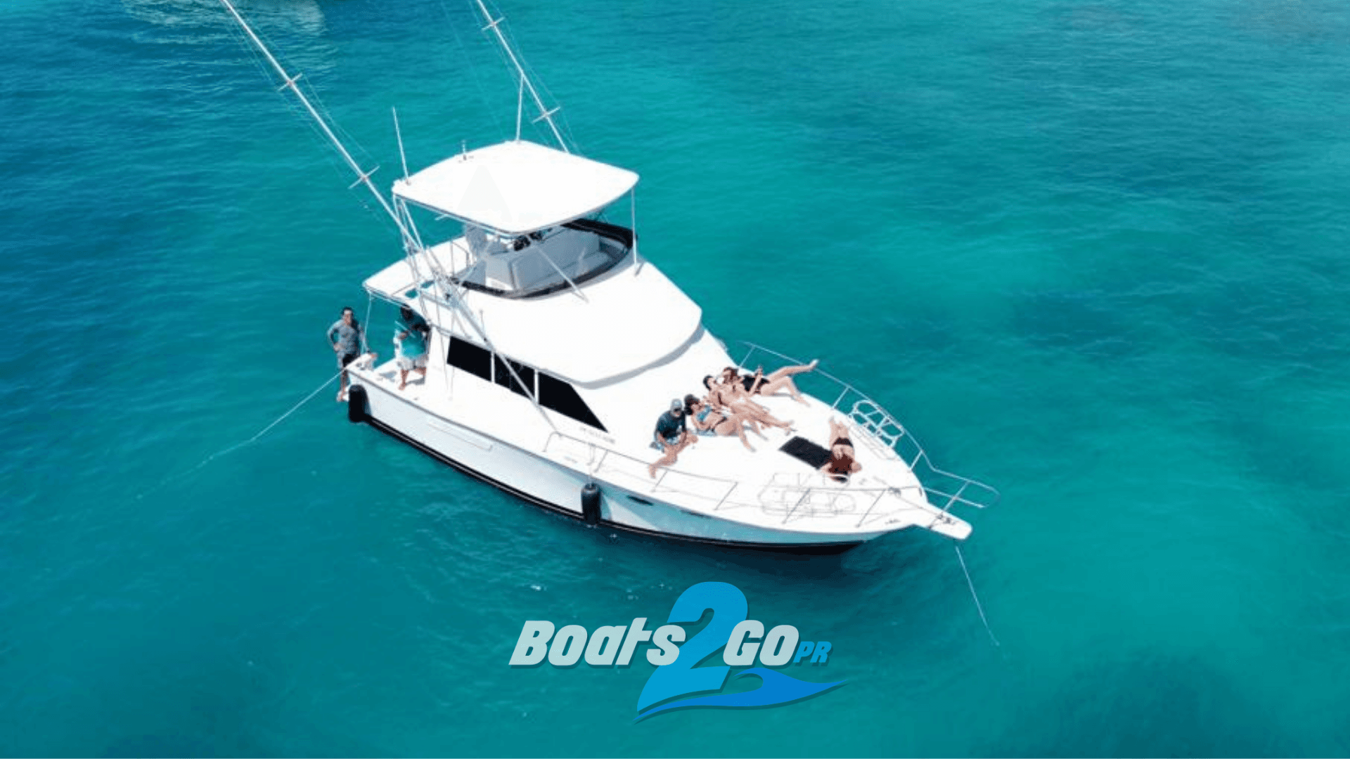 Charter yacht anchored in clear turquoise Caribbean waters, leisure