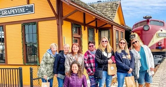 Group enjoying outdoor Grapevine train depot photo tour