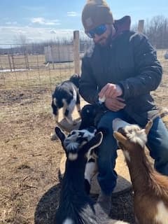 Bottle-Feed Baby Goats in Martintown: 30-Minute Farm Snuggle Experience photo 1