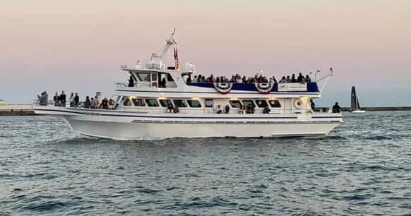 Tour boat cruising San Diego Bay with passengers on deck