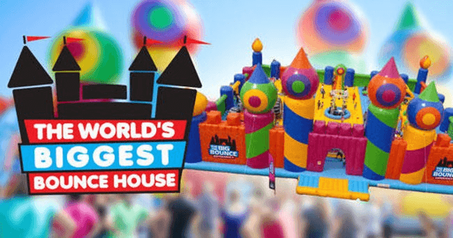 Large bounce house castle banner promoting family outdoor fun