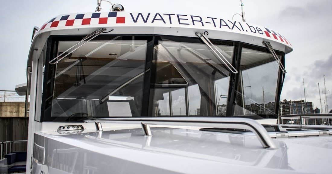 Water taxi boat close-up at marina, urban waterfront transport service