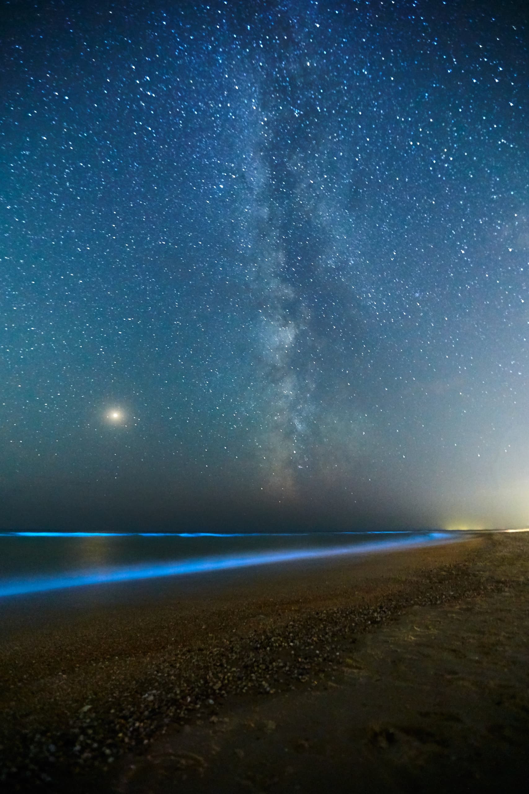 Milky Way over Holbox beach night sky with bioluminescent shore