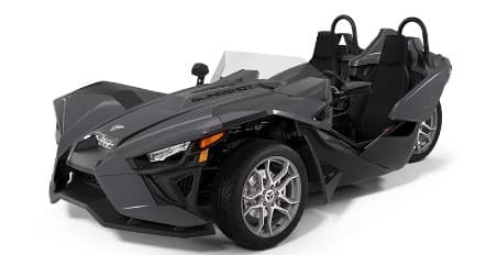 Polaris Slingshot roadster side view on white studio floor showroom