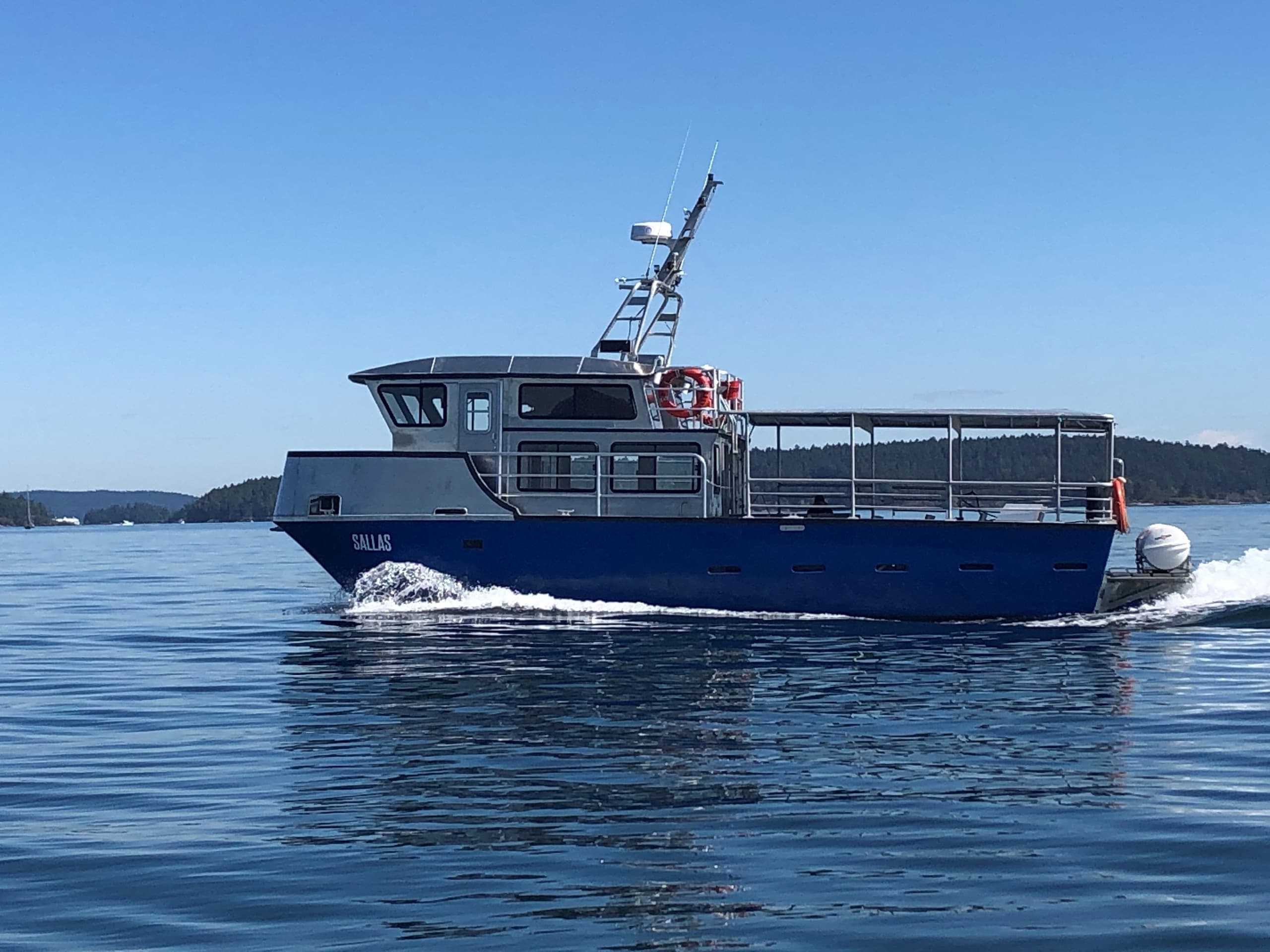Tour ferry cruising coastal waters near Sidney Spit island