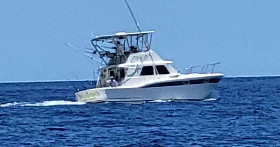Sportfishing charter boat cruising open Atlantic Ocean