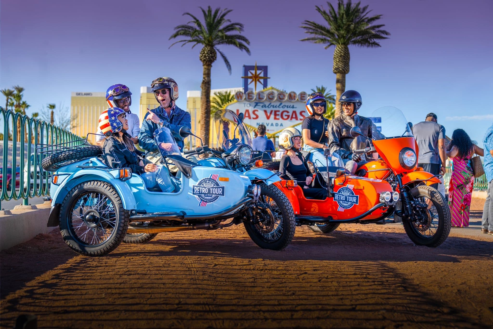 Group motorcycle sidecar tour by palm trees at Las Vegas strip entrance