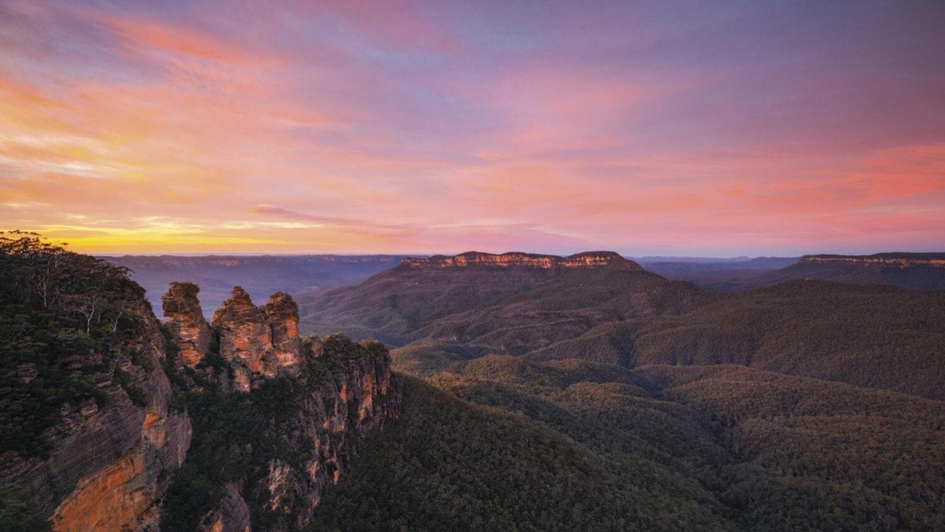 Sunset over Blue Mountains valley with rugged sandstone
