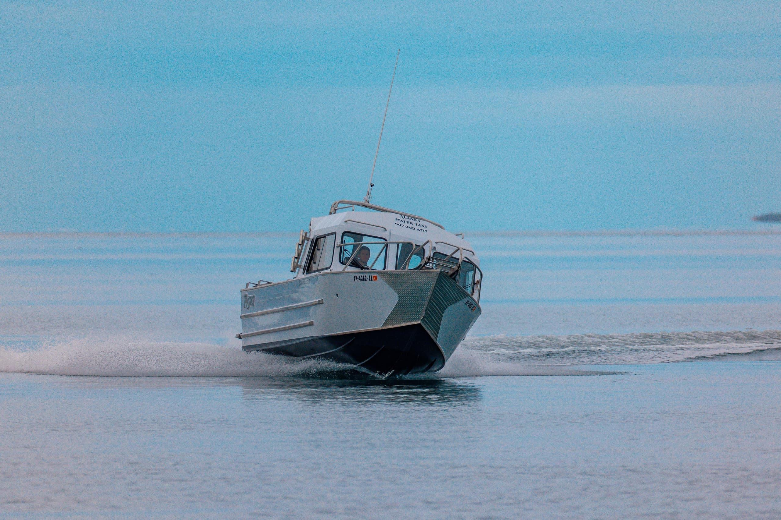 Passenger water taxi skimming coastal waters on a scenic tour