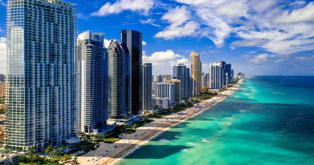 Aerial Miami beachfront skyline with turquoise ocean view