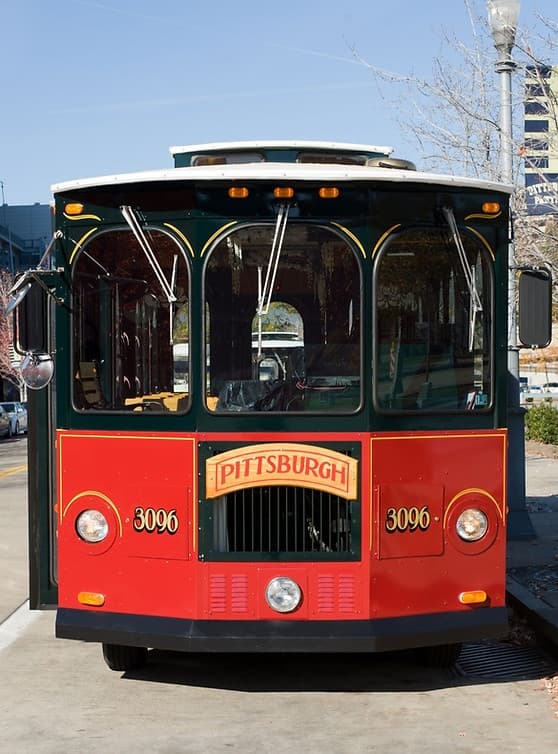 Historic Pittsburgh trolley tour driving through downtown street scene