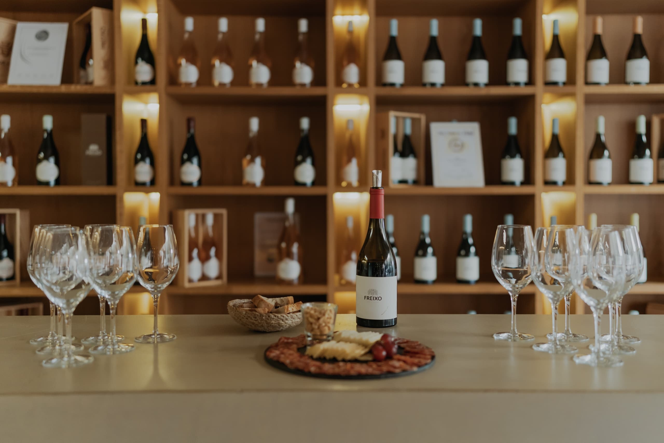 Wine tasting display and bottles in rustic tasting room