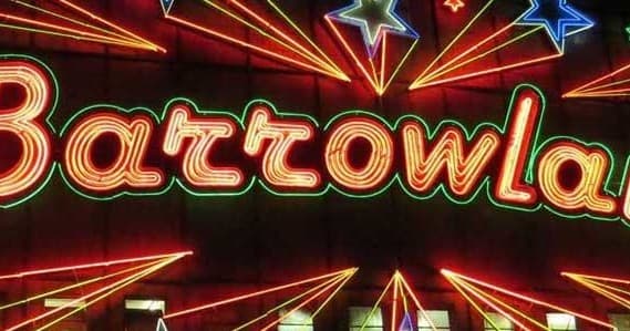 Neon Barrowland sign in Glasgow music venue exterior at night