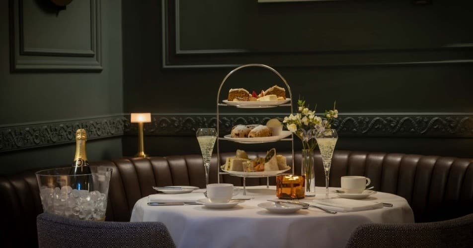 Afternoon tea set with champagne in elegant Dublin hotel dining