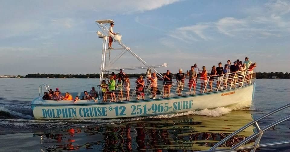 Sightseeing dolphin cruise boat heading across open sea