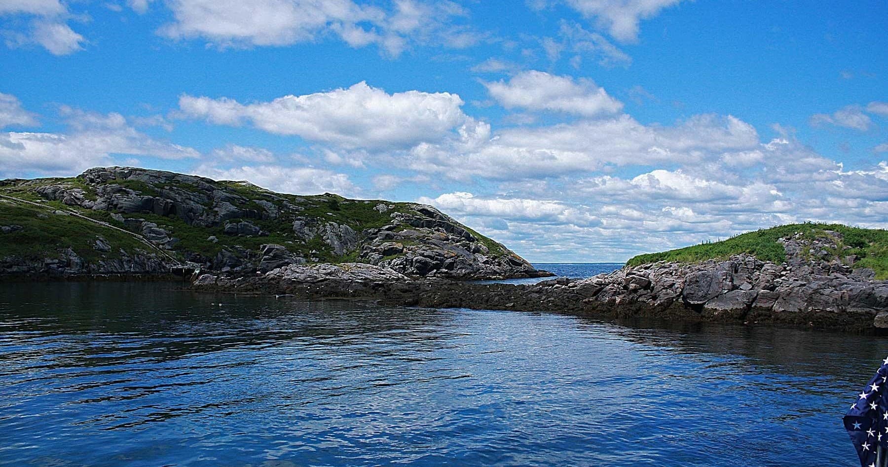 Rocky coastal cove and calm blue waters near Monhegan Island