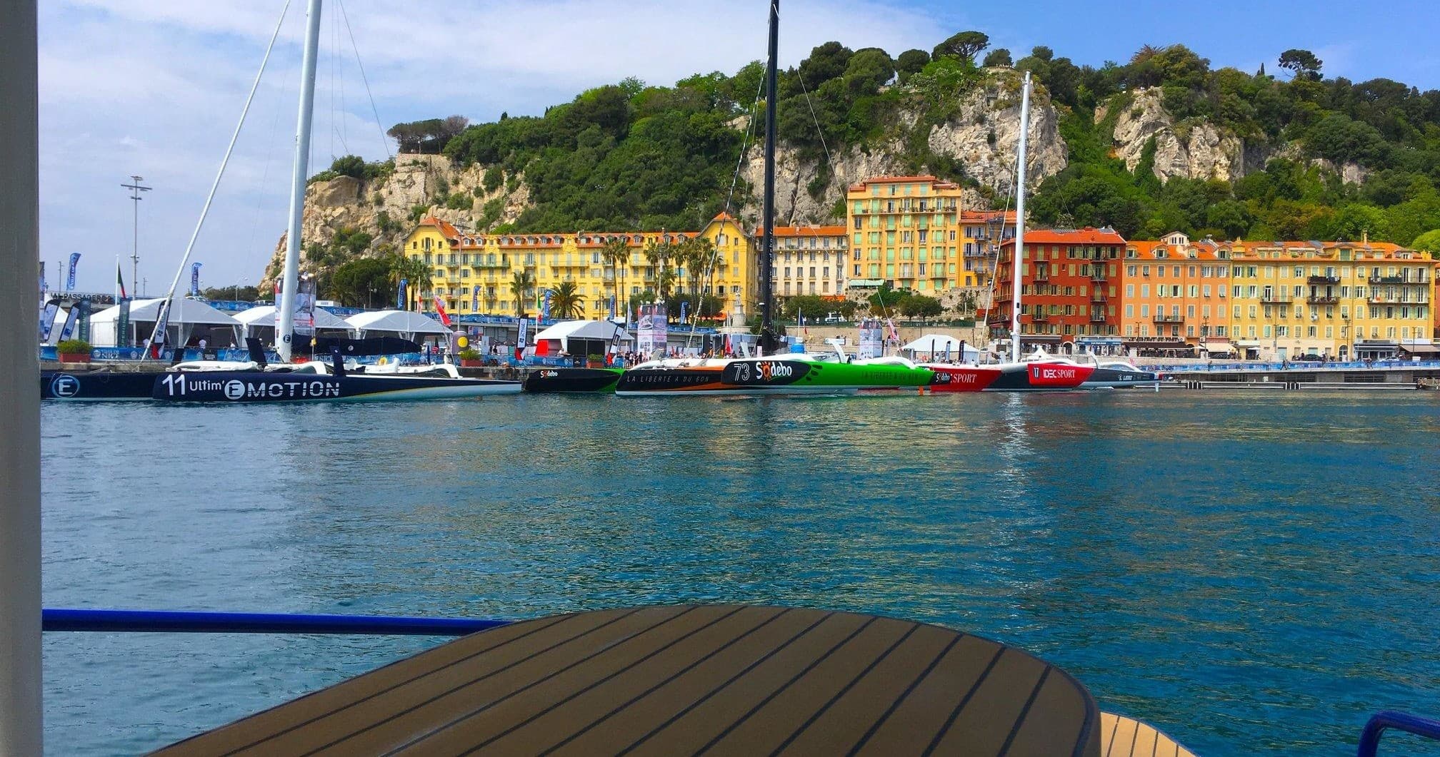 Colorful seaside harbor and yachts framed from boat viewpoint