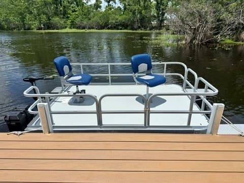 Silent Pursuit: Electric Two-Person Fishing Pontoons on Lake Latigo