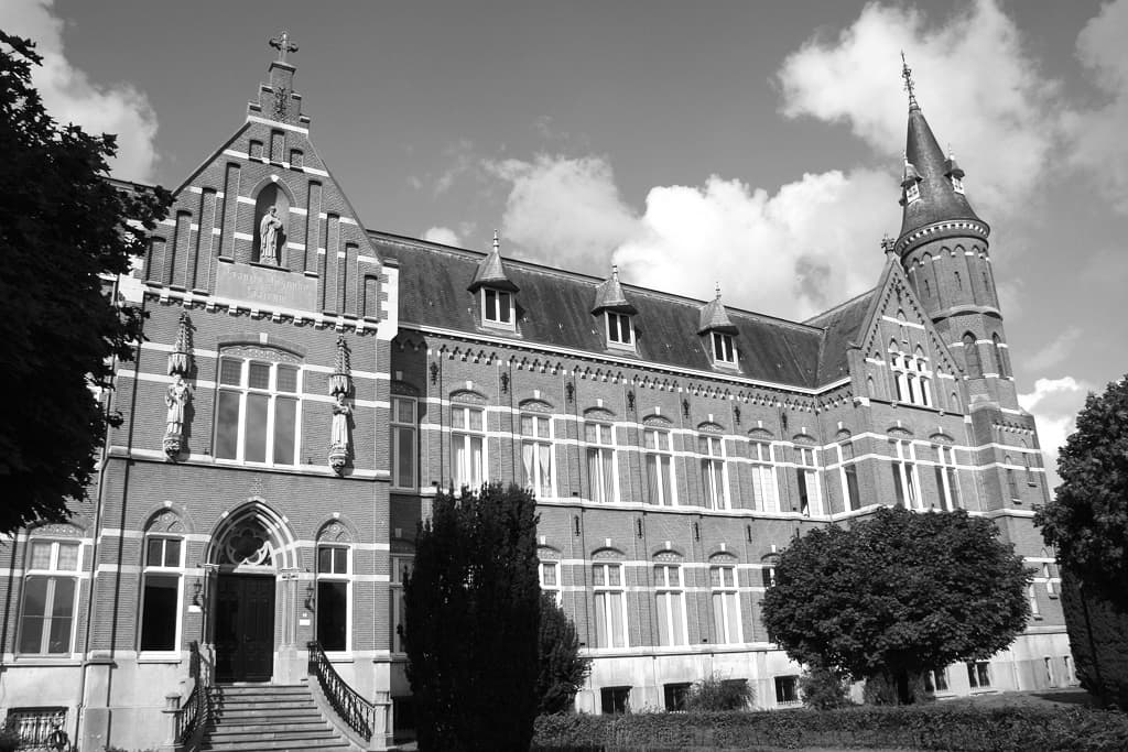 Black-and-white photo of ornate institutional building exterior