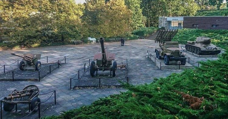 Outdoor artillery memorial and cannons at war cemetery