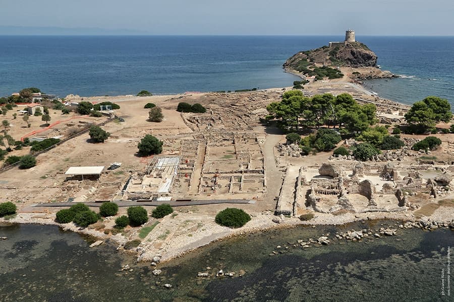 Coastal archaeological ruins on Sardinian shoreline aerial view