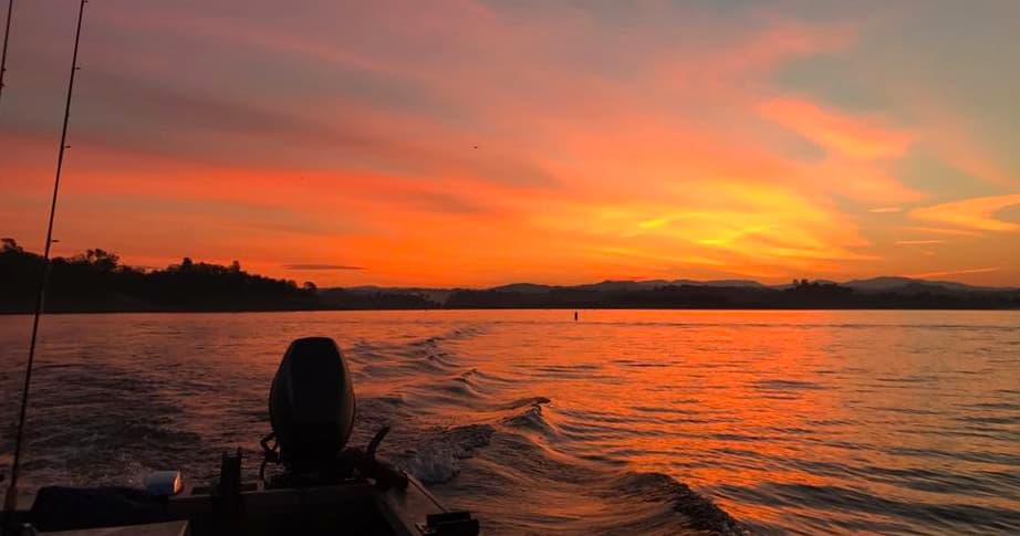 Sunset boating silhouette over Lake Camanche waters