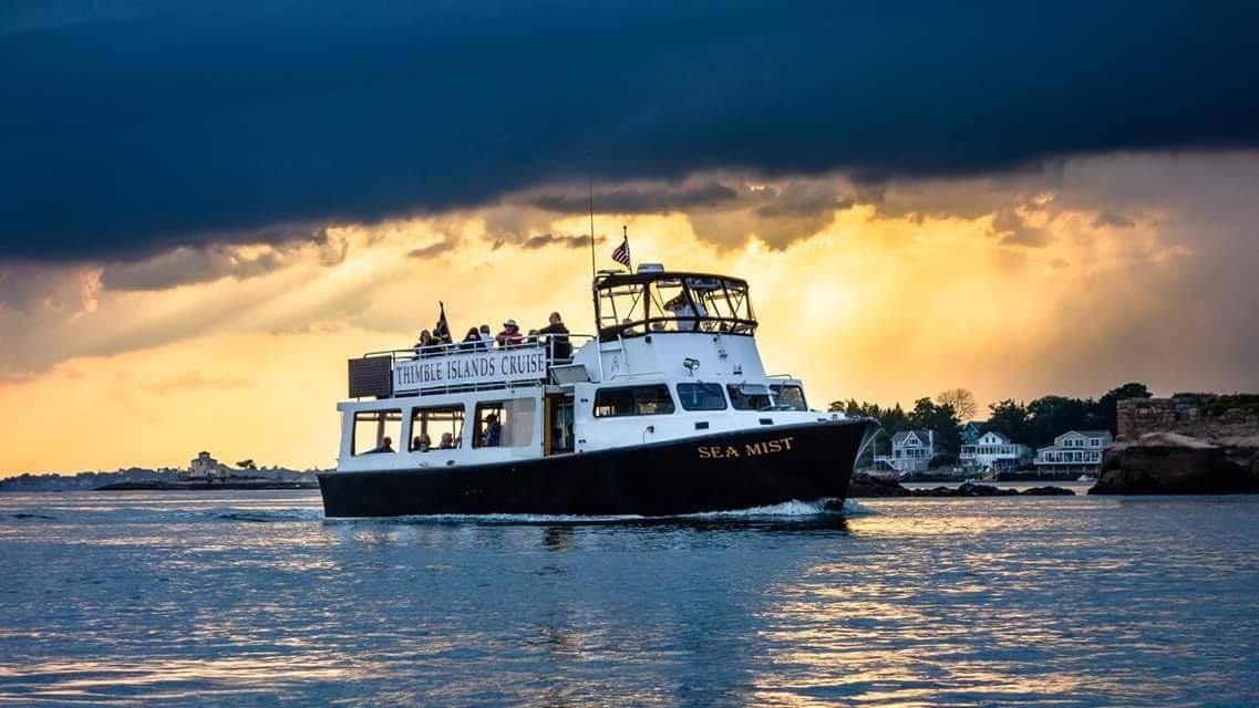 Sightseeing cruise boat near Thimble Islands at sunset