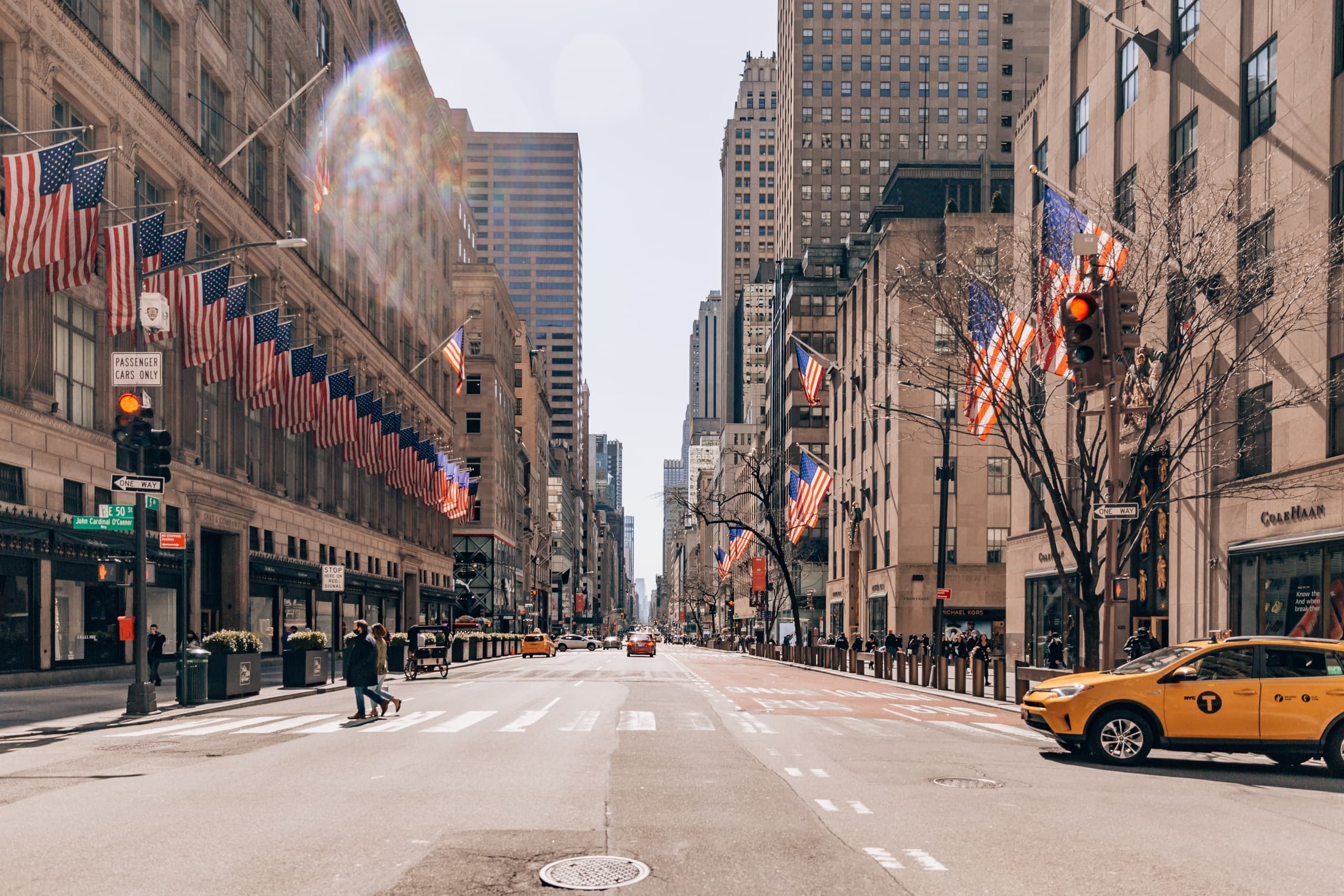 Wide urban avenue view with taxis, city street exploration
