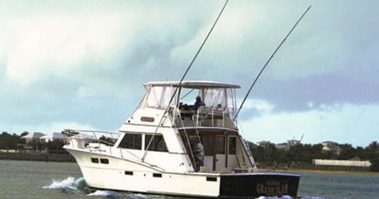 Sportfishing yacht cruising coastal waters for deep-sea charter