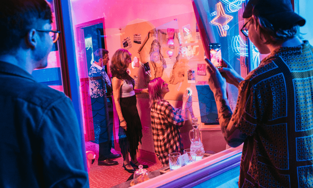 Visitors exploring neon-lit interactive art exhibit inside Floridarama