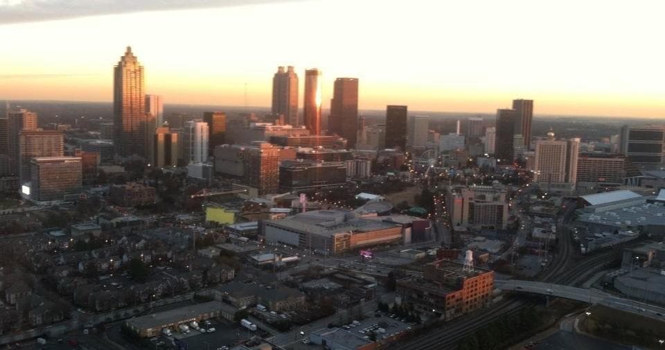 Sunrise city skyline aerial view with riverfront, scenic helicopter ride