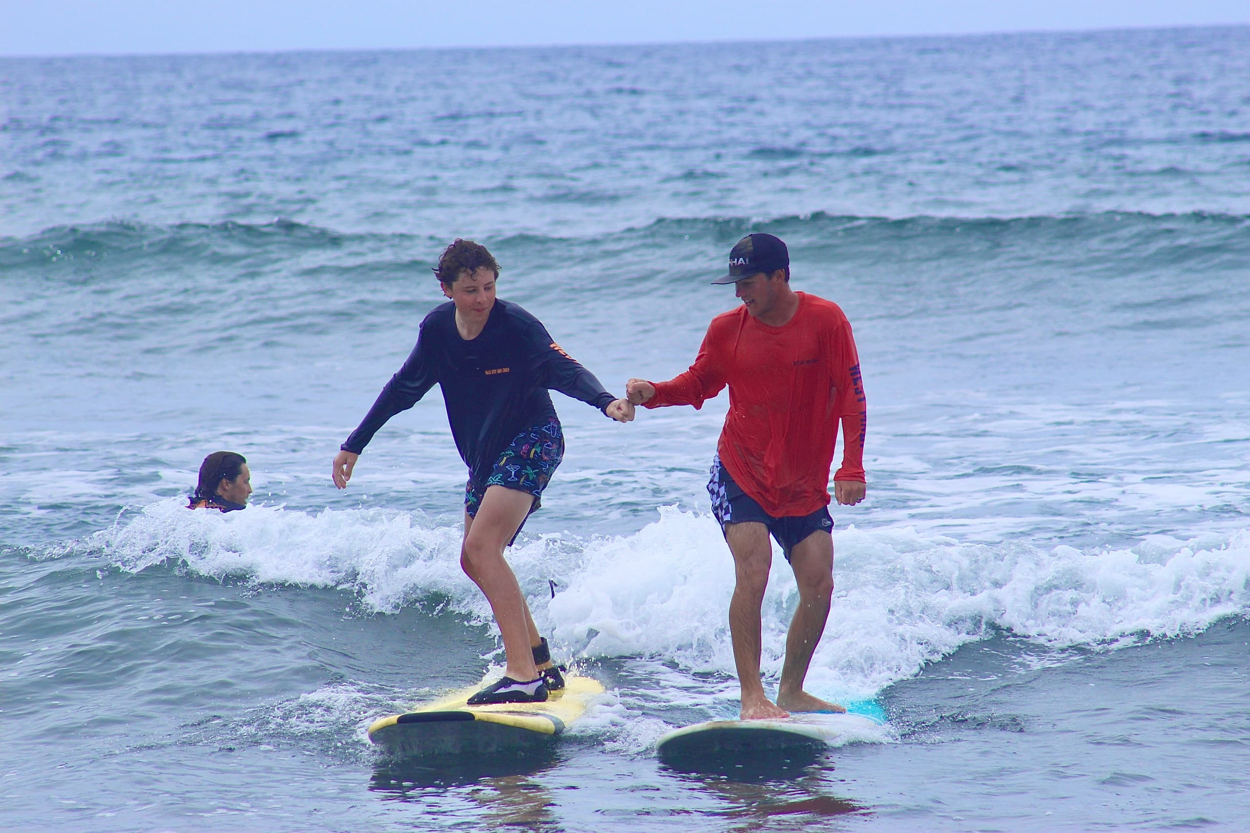The Next Step Surf Coach fleet